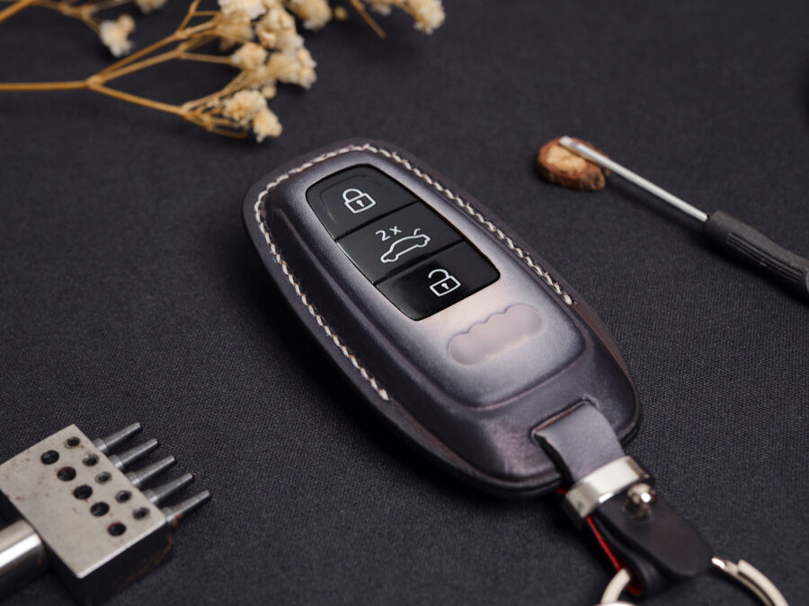 Leather Audi A Series key fob cover front view showing button layout and stitched edges