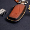 Leather BMW X-Series key fob cover back view showing smooth leather surface and contrast stitching