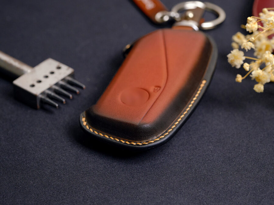 Leather BMW X-Series key fob cover back view showing smooth leather surface and contrast stitching