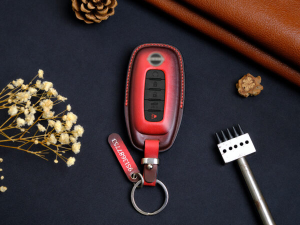 Two color versions and design styles of Nissan Sentra key fob cover in exposed buttons and fully covered with tag and keychain