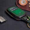 Leather Toyota C-HR key fob cover front view showing button layout and green accent panel