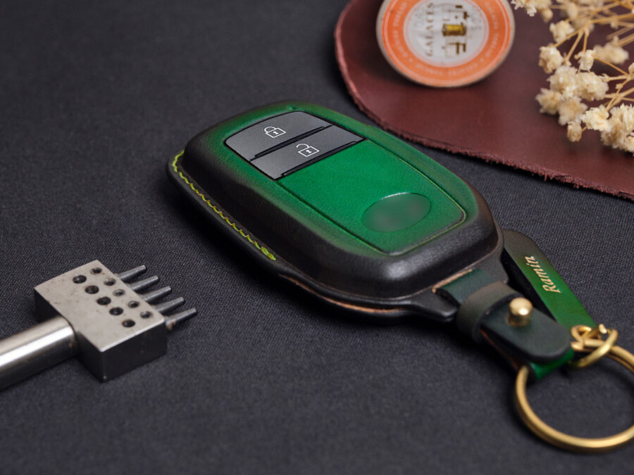 Leather Toyota C-HR key fob cover front view showing button layout and green accent panel