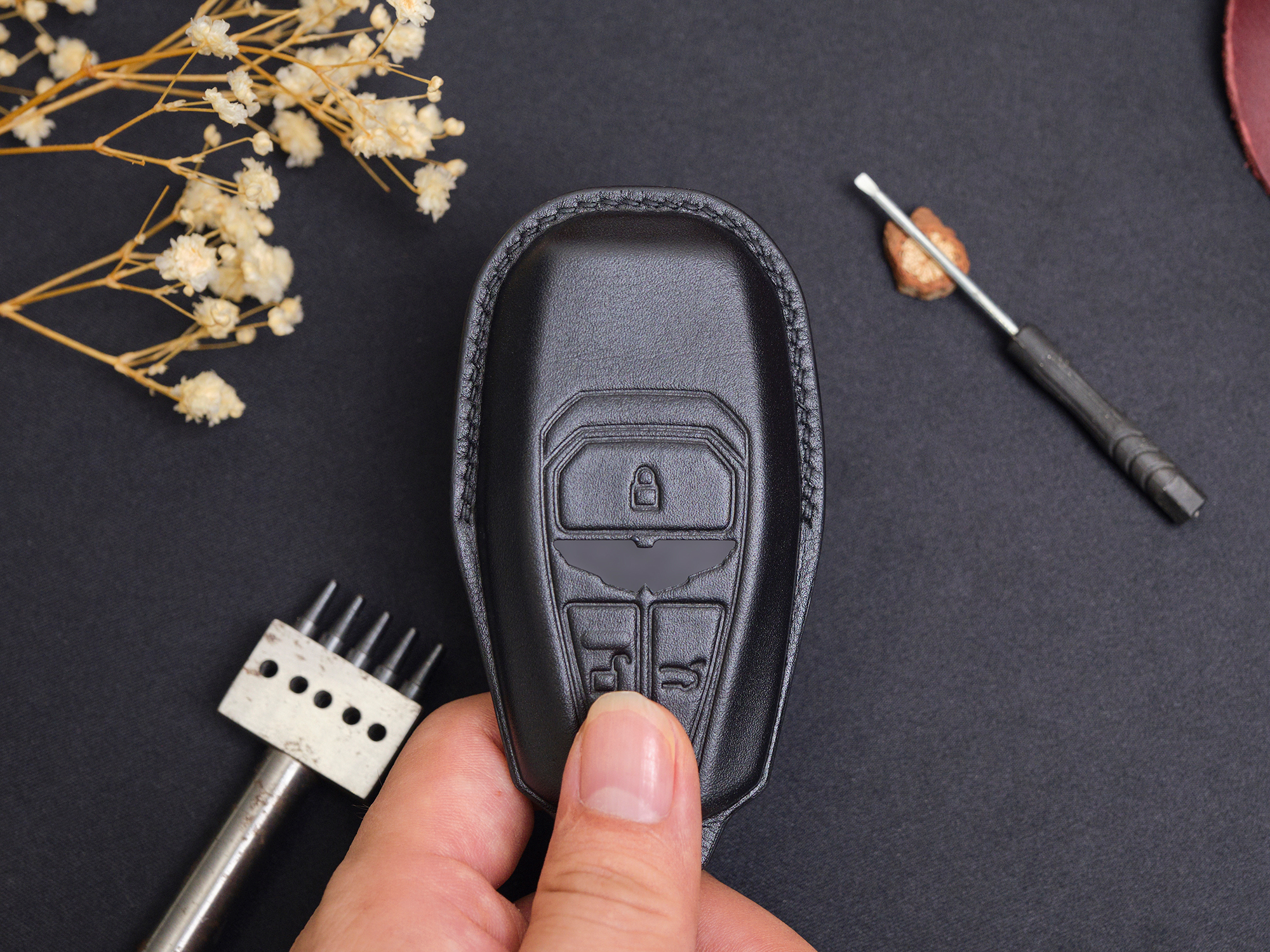 Top-class leather key fob cover for Aston Martin DB12 designed to protect against scratches, ensuring long-lasting elegance and durability.