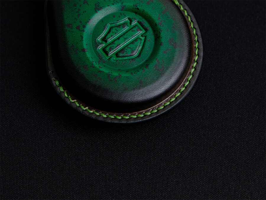 Leather key fob cover for Harley Davidson Sportster with detailed stitching showing meticulousness of craftsmen