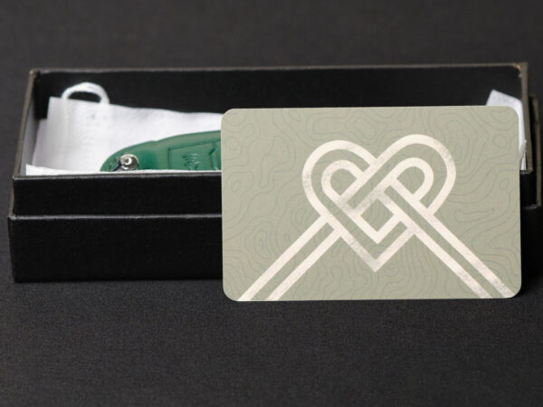 Love messages gift card with a heart shaped by a ribbon bow printed exclusive in Leather1993 with key fob cover in box gift