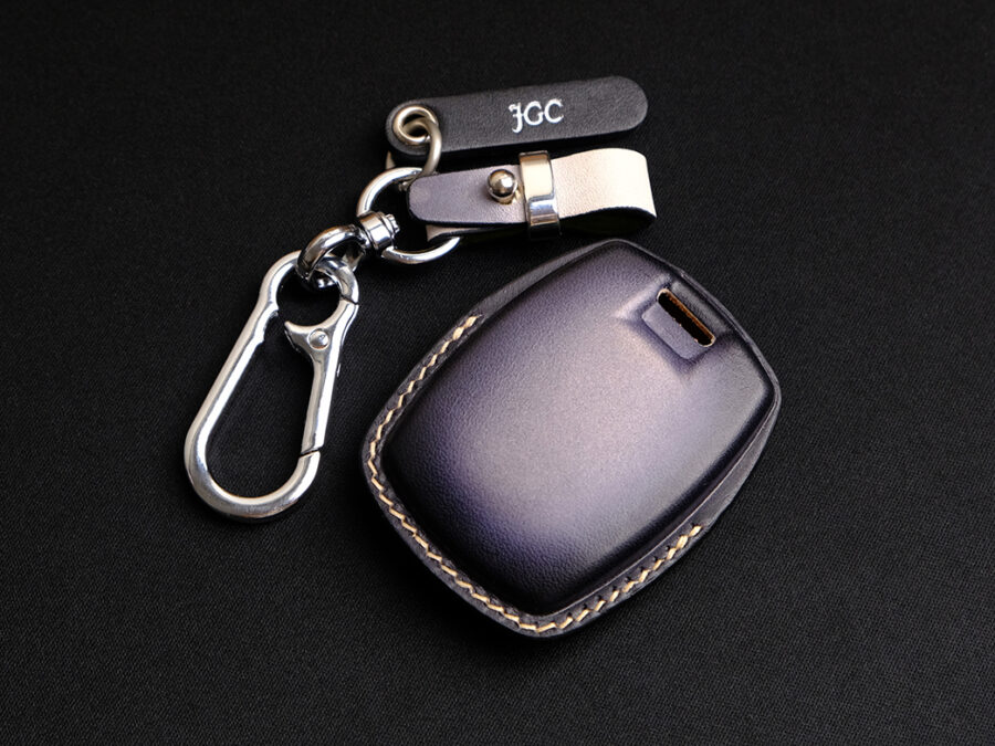 The back side of Pan America 1250 Key Fob Cover with accessories included tag and keychain