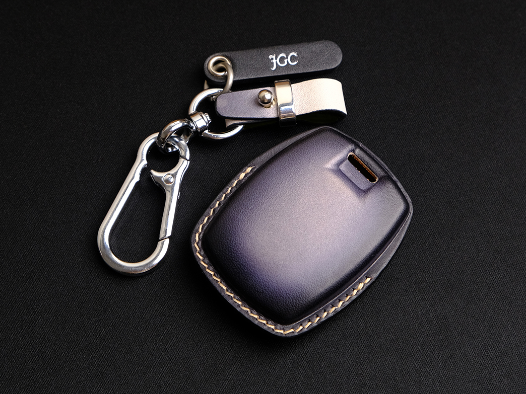 The back side of Pan America 1250 Key Fob Cover with accessories included tag and keychain
