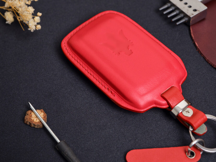 Red leather Maserati Levante key fob cover with embossed Maserati logo and stitched edges