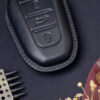 Elegant stitching of Peugeot e-208, e-2008, e-Traveller Key Fob Cover is sewn by skilled craftsmen