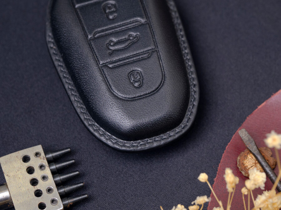 Elegant stitching of Peugeot e-208, e-2008, e-Traveller Key Fob Cover is sewn by skilled craftsmen