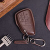 Leather GMC Sierra key fob cover with metal keyring and leather tag displayed on dark background