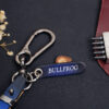 Engraved leather tag labeled BULLFROG attached to metal keyring for Audi Q-Series key fob cover set