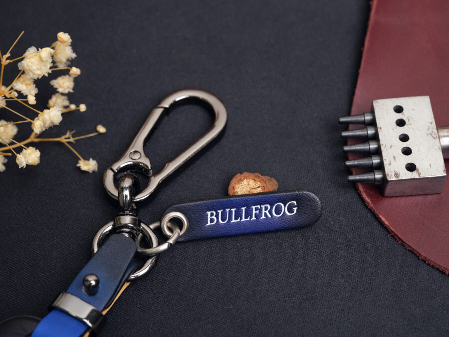 Engraved leather tag labeled BULLFROG attached to metal keyring for Audi Q-Series key fob cover set