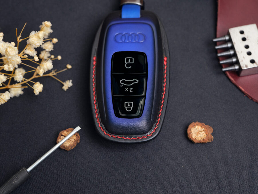 Leather Audi Q-Series key fob cover front view showing button layout and red contrast stitching