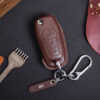 Leather Ford Ranger key fob cover with metal keyring and engraved leather tag displayed on dark background