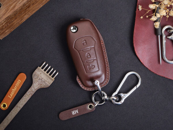 Leather Ford Ranger key fob cover with metal keyring and engraved leather tag displayed on dark background